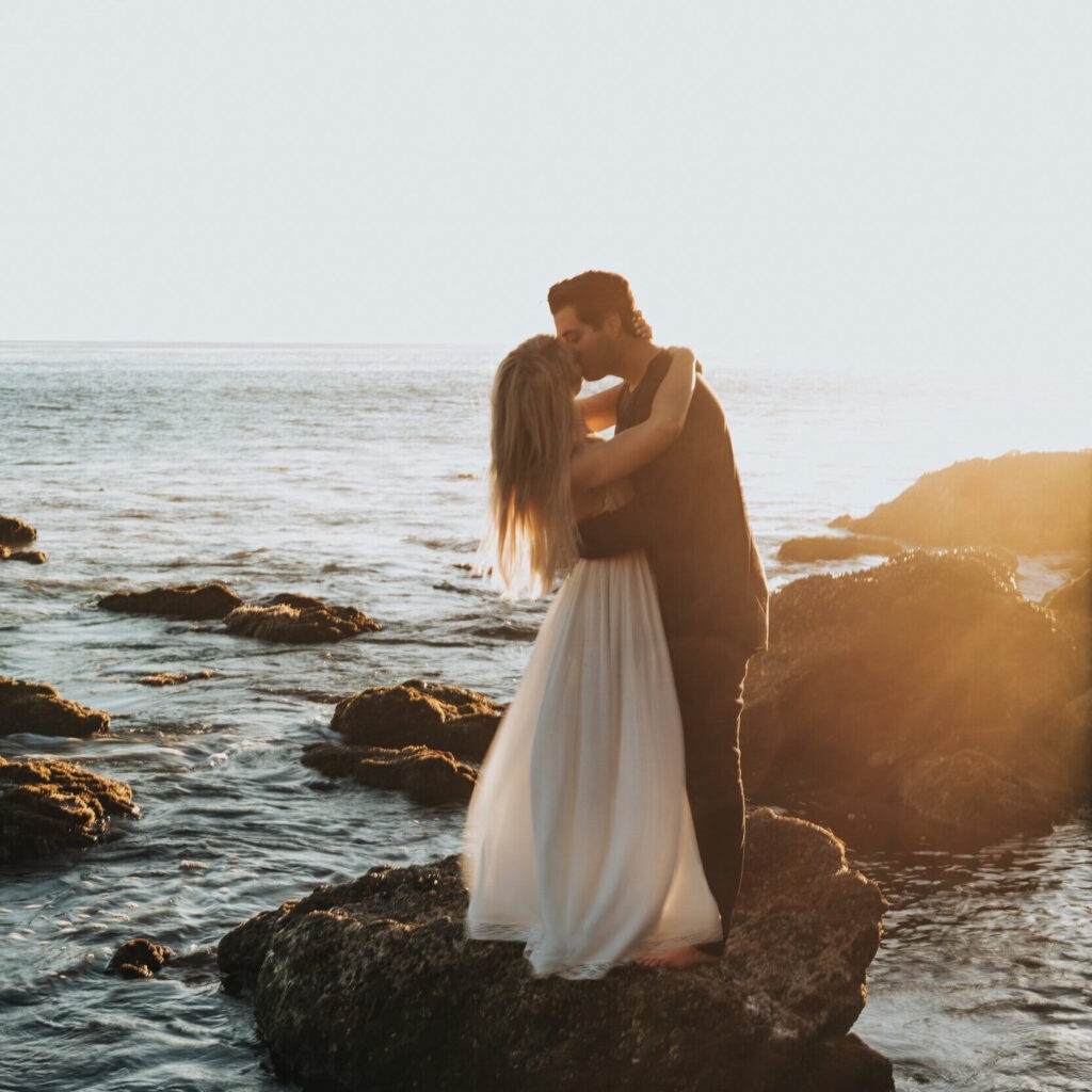 bride and groom kissing at larchmont beach wedding video
