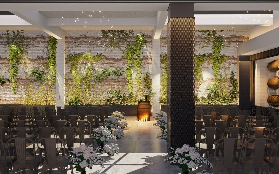 Wedding venue in winery with seats, flowers and brick wall with plants