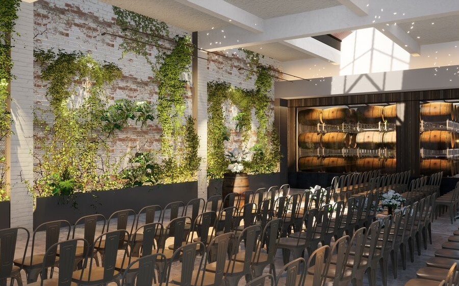Wedding venue in winery with feature brick wall containing greenery