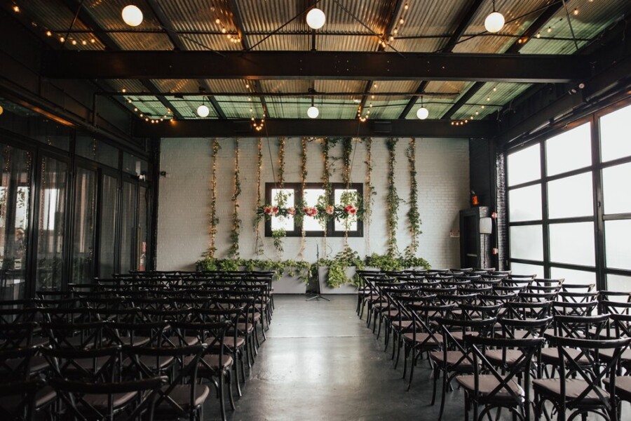 Wedding venue decorated with flowers and greenery