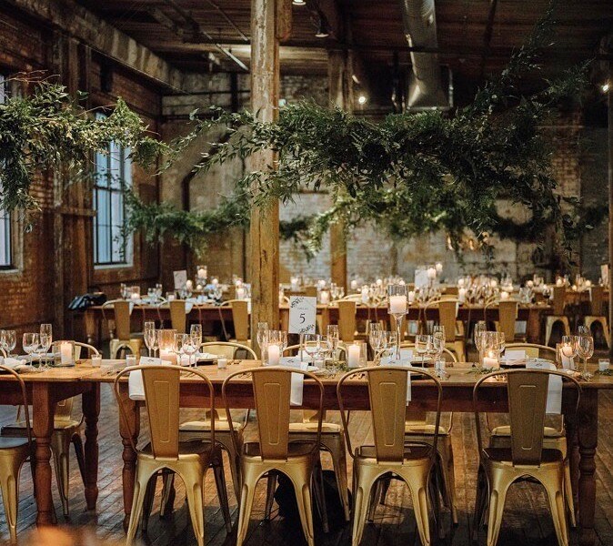 Wedding Reception with long tables decorated with candles and tableware
