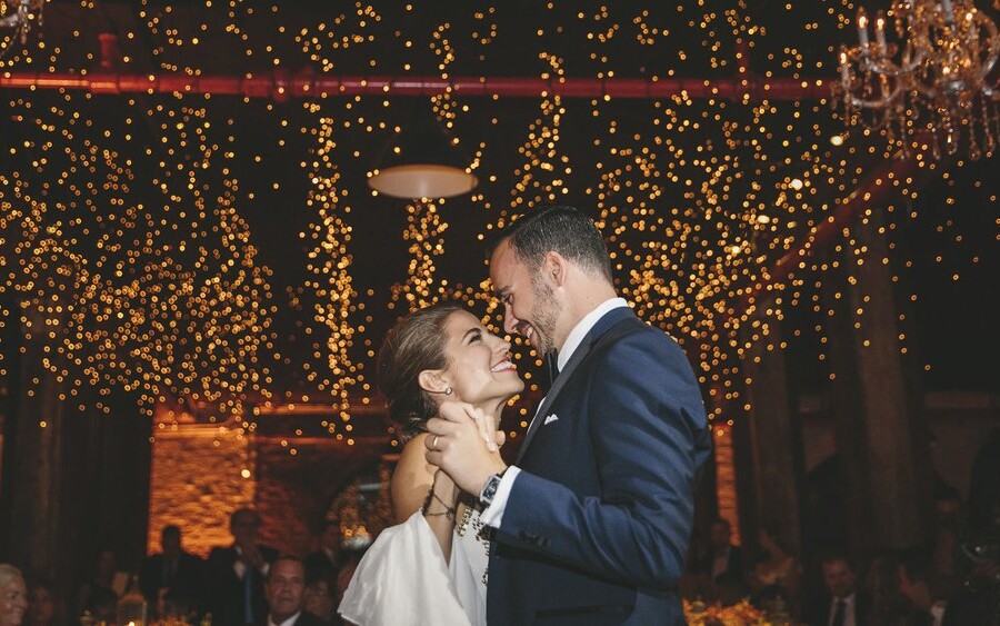 Bride and Groom dancing under lights